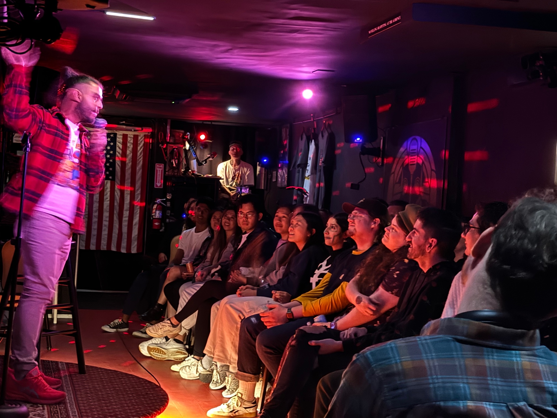 Audience laughing together at a No Drink Minimum comedy show